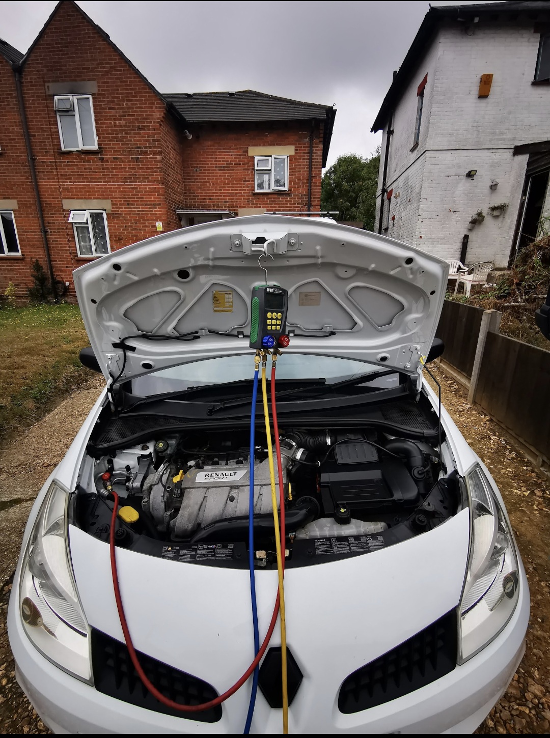 White Renault Sport Megane AC recharge service